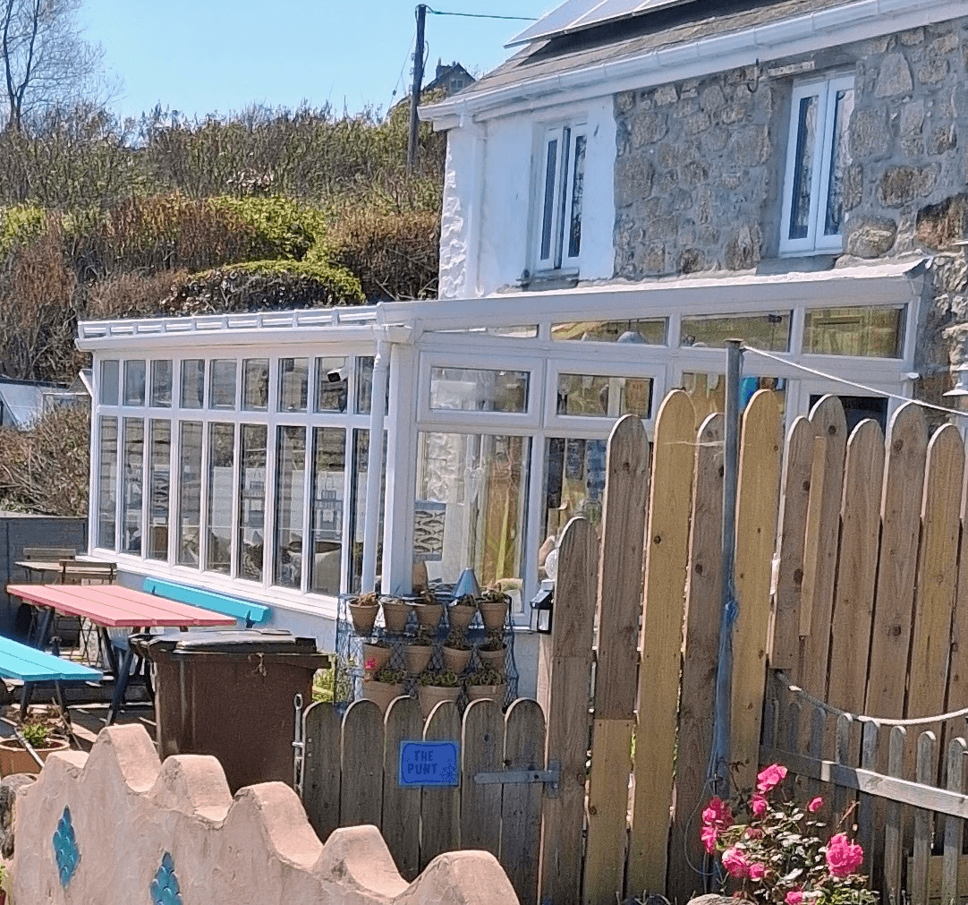 White lean-to conservatory installed in Devon garden
