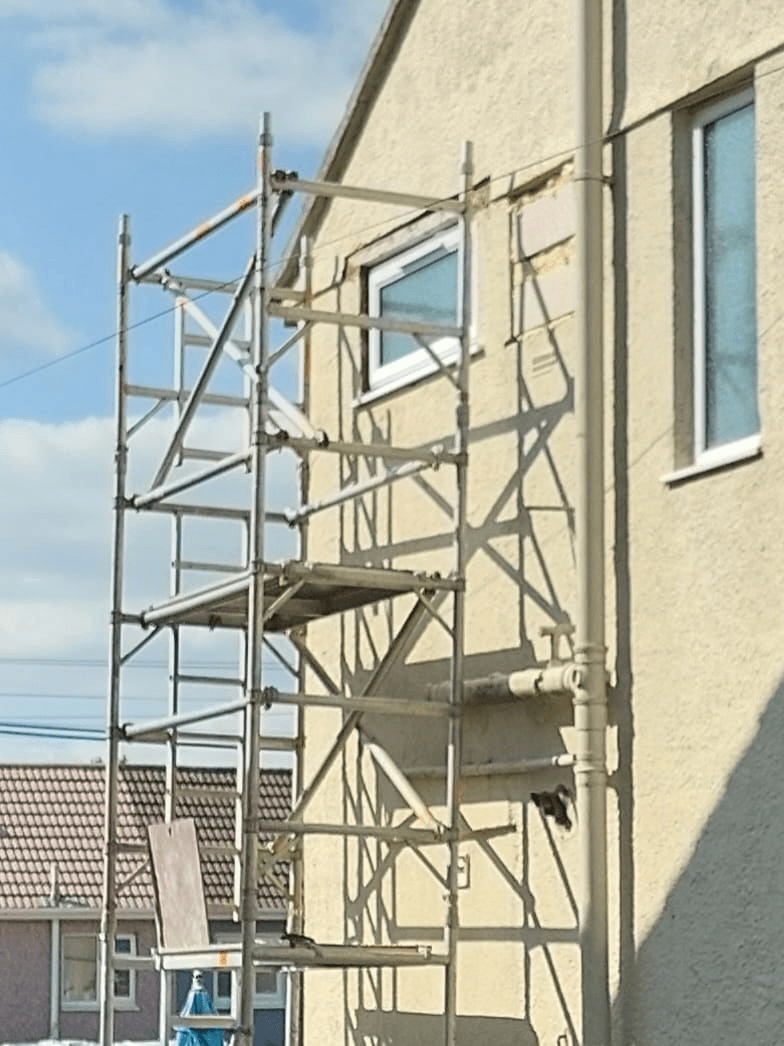 UPVC window installation with scaffolding