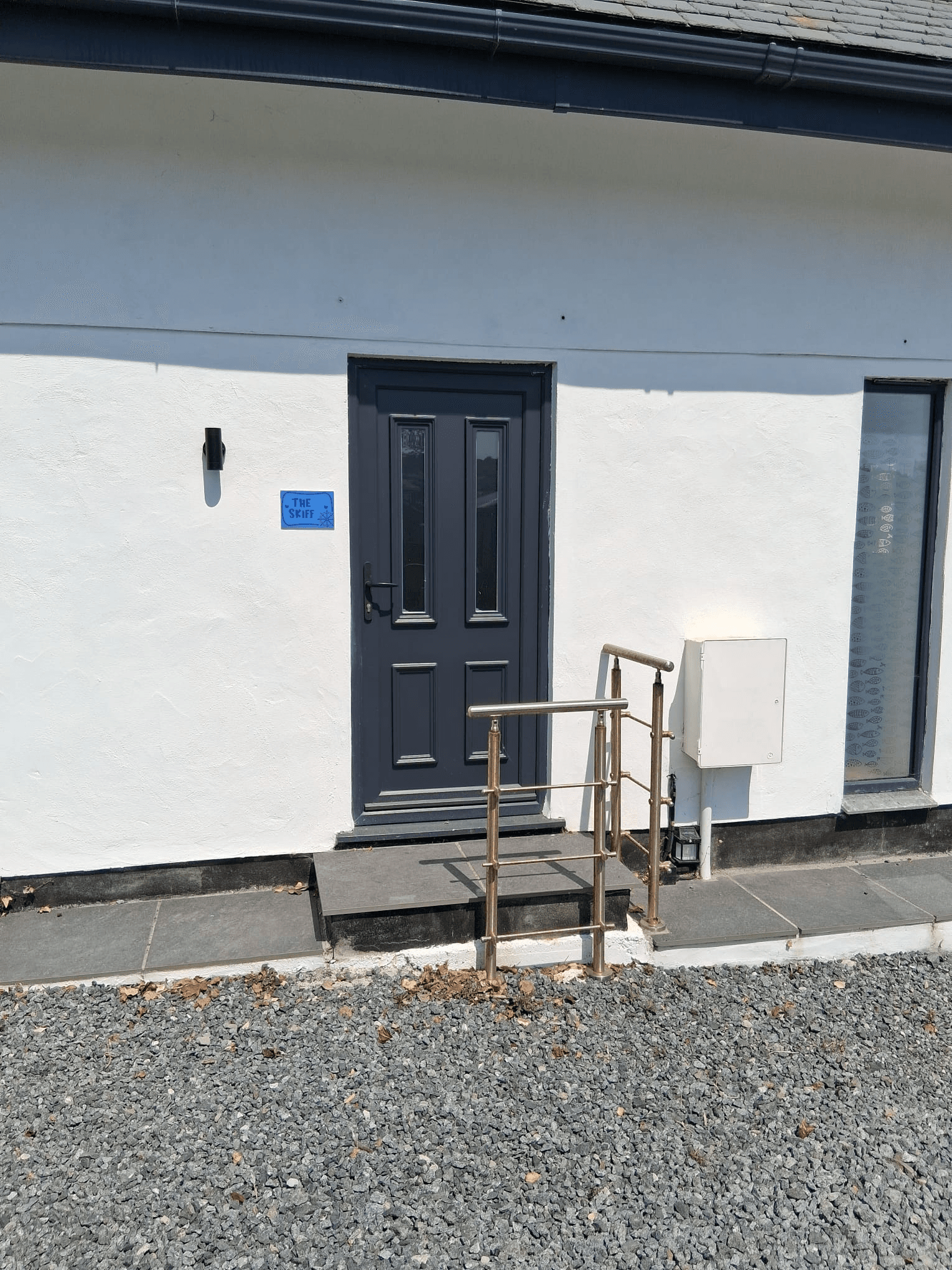 Traditional composite front door on a stone house