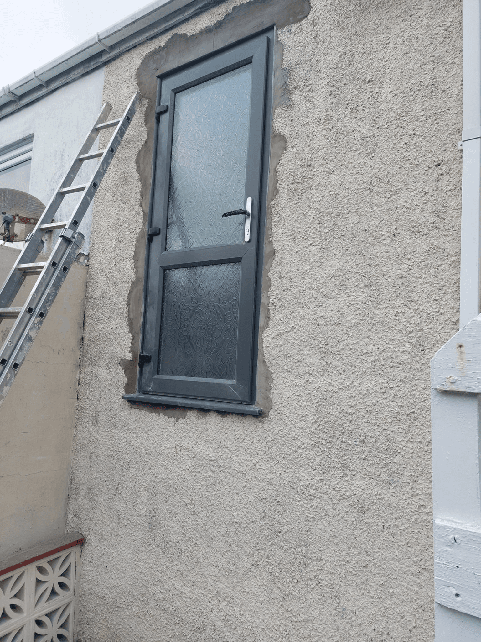 White UPVC windows fitted to a house exterior in Devon